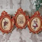 Set of 3 Alice in Wonderland mini oval pictures. Deep red and gold frame.